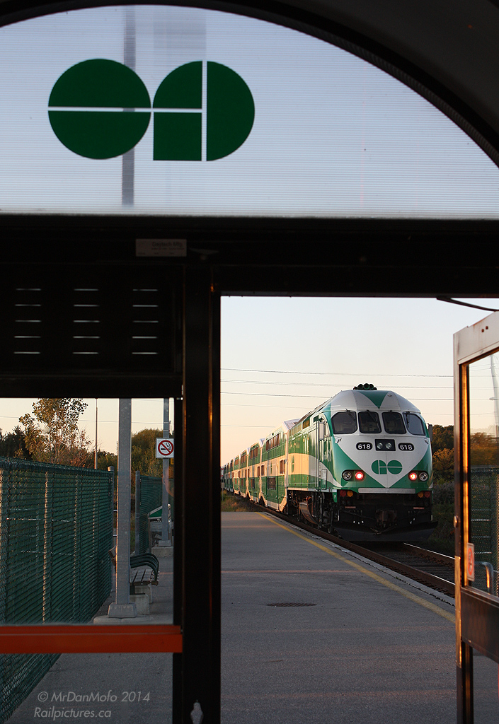 The passengers have hopped off and hurried to their cars, the doors have closed, and the last train of the evening on GO Transit's Barrie Line blasts out of Rutherford Station, with MP40 618 on the tail end howling past empty shelters and deserted platforms at last light.
