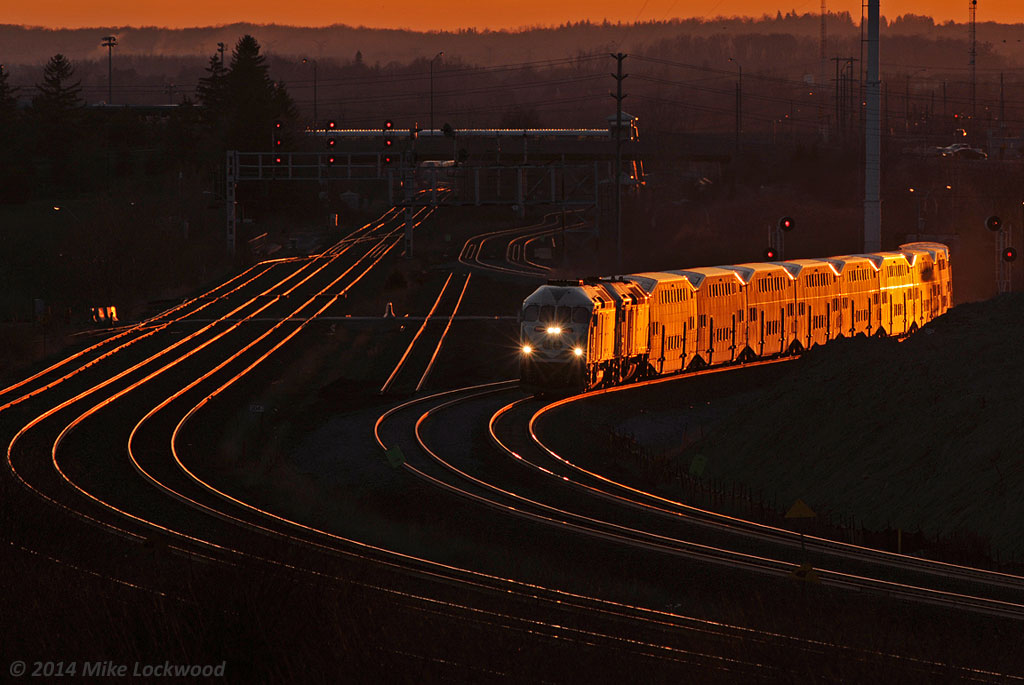 The setting sun illuminates an eastbound GO train as it negotiates the recently opened (within the last week) shoo-fly around the South Blair Road grade separation. The new GO 660 leads 612 on a shakedown run. Shot was taken with my 300mm 'howitzer' hand held and manually focused, a real adventure given that this lens does not have an infinity and my eye won't focus anymore! 2008hrs.