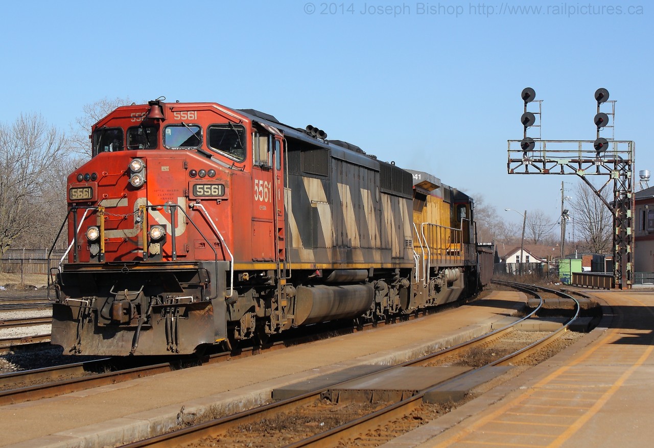 CN 435 comes under the signals at Brantford with CN 5561 and CN 2041 providing the power for that days train.  CN 2041 is an ex CREX C40-8 that CN has put into service with with patches over the old reporting marks.  They have been making their way around the CN system, I saw three different ones in three days this week.