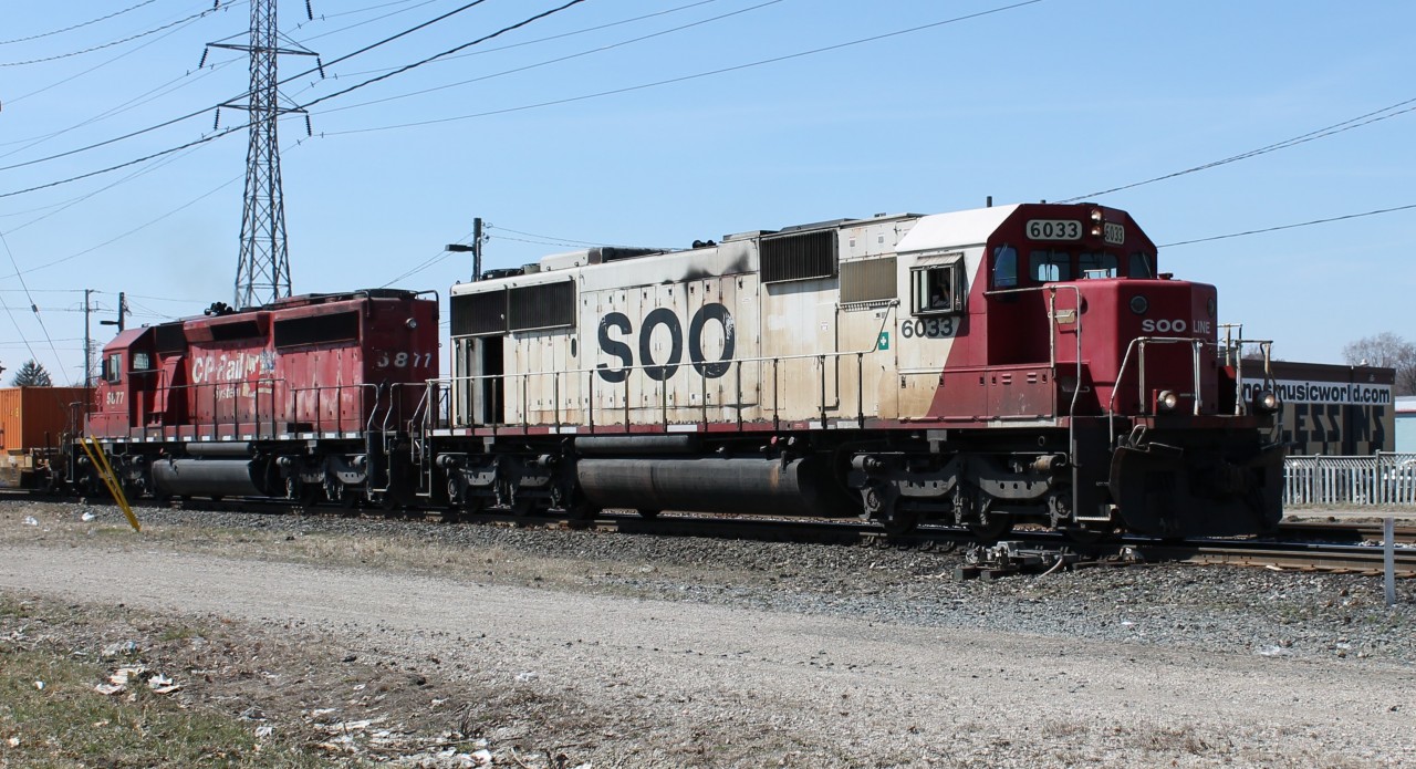 While my parents were grocery shopping I went train-watching. I was lucky enough to catch CP 234 with SOO 6033 and CP 5877 on the point.