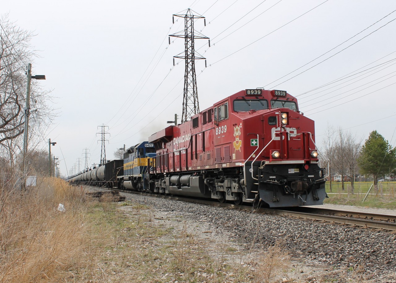 I decided to go do some Easter Monday train-watching and I saw a couple of trains. The first was CP 640 with CP 8939 and IC&E 6422. I'm not sure what that decal on the nose of 8939 is for.