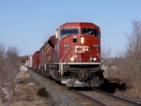 9142 leads an unknown southbound train through CP Medonte near Coldwater, ON