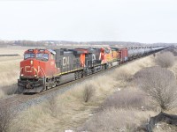 A trio of General Electric built units including CN 2696, 2845 and BNSF 5367 have an ethanol train stretched out over the countryside south of Milton.