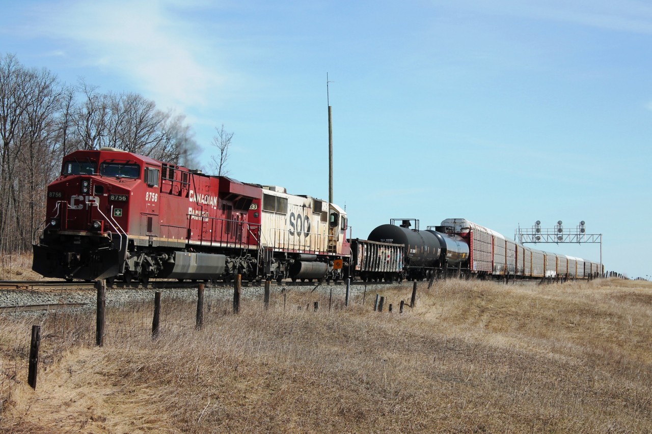 Good Friday comes a week early with sun and temperatures in the teens. What a difference from the last two Fridays! CP 8756 and SOO 6033 pick up cars before heading west.