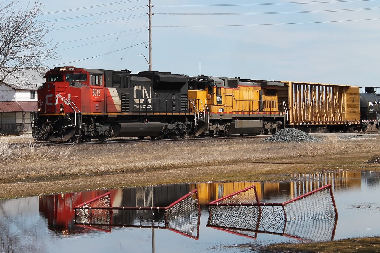 Image caption: The temporary hockey rink becomes a temporary lake at Princeton. 331 heads west with the second unit, 2014, giving problems. According to the scanner it was constantly overheating and needed the doors open to help keep it cool!