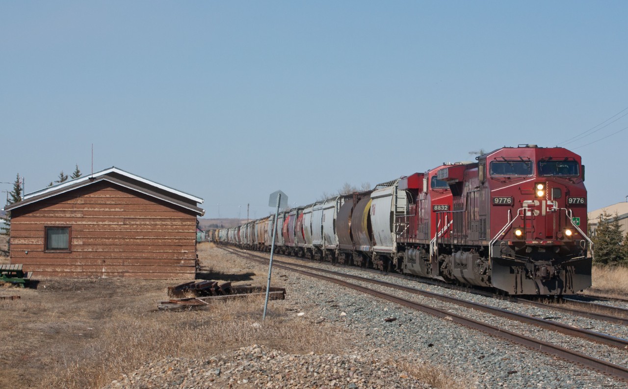 Railpictures.ca Cam Leonard Photo Southbound grain train through Aldersyde Alberta