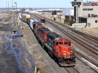 CN 570 departs Macmillan yard with 2 GP9u's and a Widecab with a string of manifest for Oshawa. For a fun fact, Canadian National's Macmillan yard is the largest of its kind in Canada.