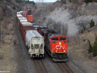 Perfect timing. A westbound CN mixed freight train meets a Eastbound CN intermodal train, the screaming engines go by Hilda Ave with a nice horn salute for the railfan, nice crew on board.