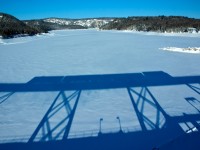 Shadow of the Southbound ACR Passenger train on the Montreal River trestle.  The cliff in the background is part of JEH MacDonald's "Solemn Land"