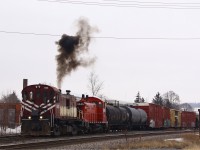 After dropping of a cu of autoracks (barely visible behind the train) the engineer in OSR 503 looks over top of 1245 to push the remainder of the train onto the siding. The supercharger  just catches up to the increase in RPM’s on 503 ending the black stream of smoke distinctive to the MLW’s (and GE’s on occasion).  