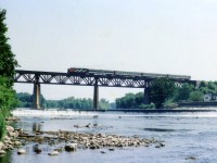 Westbound CN passenger train #81 rolls westward over the Grand River at Paris in this pre-VIA scene on what I recall being a rather sticky & muggy morning . Unable to record the locomotive number.