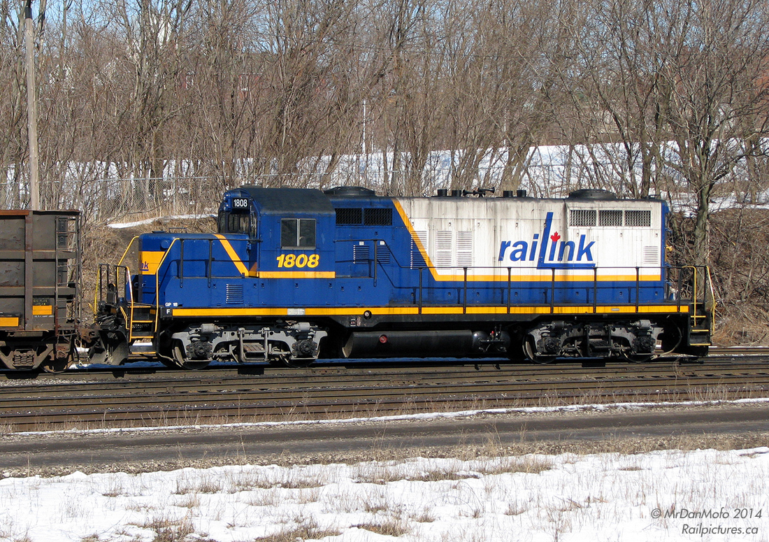 Tasked with the duties of switching Southern Ontario Railway/Railink's Stuart St. Yard near Hamilton Harbour, RLK GP18 1808 (in an attractive blue and white livery) works a cut of cars at the south end near the Bay St. bridge. Today these duties are handled by newer power, and the area is rapidly changing with the coming of a new GO Transit station for extended rail service to Hamilton, into the Niagara regions beyond.