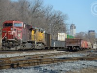 At Kinnear - 143 pauses - not for a crew change, for paperwork with a splash of yellow of the Union Pacific.
