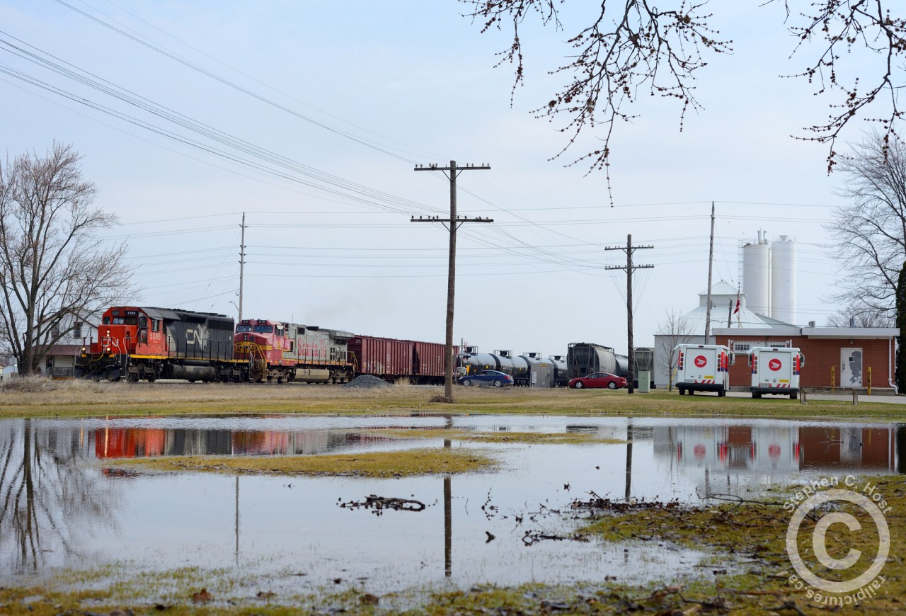 Empty oil train, #711 flies through Princeton Ontario - a bucolic little town between Woodstock and Paris/Brantford. Thanks to John Lowes for the inspiration - the temporary pond made for a nice backdrop for the three of us who were present.
