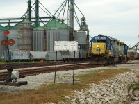 In response to Geoff Elliott's recently posted great photos of the CSX in the early 90's - I submit some far away CSX Branchline action - as far as you could get from Sarnia when I started to pay attention. Seen here is the sprawling W.G. Thompson facility at Blenheim, being switched by train D724 (Chatham to Blenheim, return to Sarnia). A few neat details found in this scene<br><br>* Ancient tall Switchstand, likely dates to building of the line and found throughout the former #1 Subdivision<br>* Dwarf signal - remnant of CTC which was installed on the former #1 Subdivision from Pelton to Ridgetown (MBS/OCS from Ridgetown to St. Thomas) - CTC removed sometime in the mid 90's<br>* W.G Thompson was set up to load unit trains, and did so a few times per year with just about anything from the CSX roster. Unit train loading has ceased upon CN taking over Blenheim in Feb '06.<br><br>Looking foward to others who share mainline and branchline action from the CSX, Chessie System, C&O and possibly the Pere Marquette in Canada - we're more than just CN and CP, right? :)