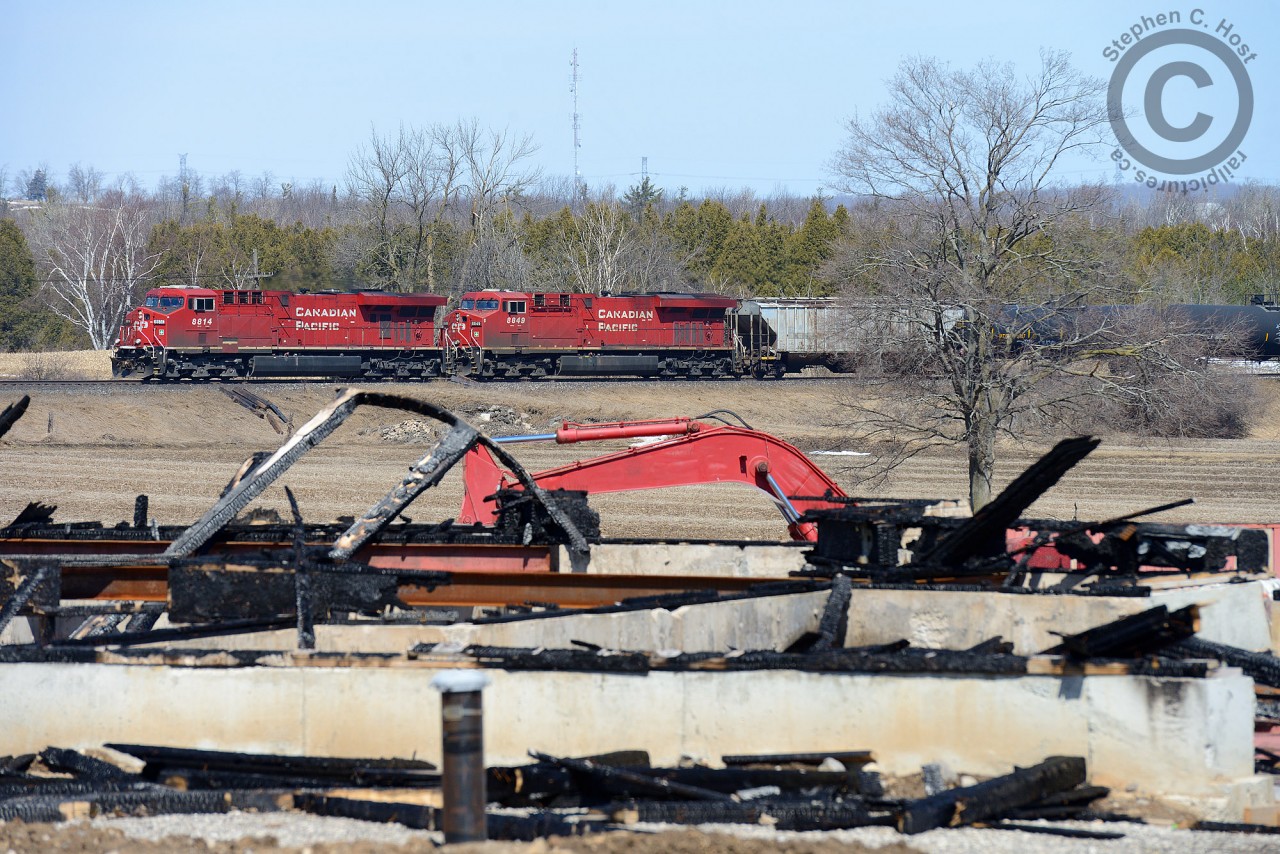 In 2013 this home was partially constructed - framing, walls and roof were completed when suddenly it burnt to the ground. Ethanol 641 is slowing to take the siding at Puslinch with the 'one of a kind' 8814 in the lead.