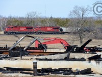In 2013 this home was partially constructed - framing, walls and roof were completed when suddenly it burnt to the ground. Ethanol 641 is slowing to take the siding at Puslinch with the 'one of a kind' 8814 in the lead.