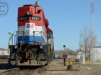 <b>Switch B43</b> is lined for the reverse for the last time from the former SOR (CN) Shop building at Hamilton -  meanwhile the crew waits about 10 minutes to get the attention of the RTC. Taking advantage of the temporary perch, a bird of prey flew atop RLK 4057 looking for its next meal. After about 4 minutes this bird took off for a kill. Any birders on here that can identify the bird - I can send a full size photo if the bird if need be.<br><br>Over the next weeks to months this entire area should be transformed - two new GO mainline tracks are set to be installed where I am standing for the James St. North station - and will look very very different - everything you see here is in the way and will be demolished.