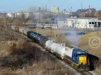Ferguson ave still creates railway memories, but not as profound as <a href=http://www.railpictures.ca/top-images> Arnold Mooneys</a> shot, presently our #1 image alltime. With industrial Hamilton in the background, SOR 495 is headed back to the yard on the N&NW Spur and chugging mightily up the grade, about to pass under Ferguson Ave to meet the CNR Grimsby Subdivision. RLK 3873 sports a rather tasteful patch job, eliminating the Raillink logos, most likely a transitional scheme before application of G&W Orange.<br><br>For the history buffs - the N&NW Spur, (Formerly the Hamilton & North Western railway mainline) had a grade seprated underpass with the Great Western Railway here (which survived well into the CN Days) and a roundhouse, shops and yard just to the south (Behind me) - the outline of which can still be seen today. Only in the last 2 years has the HNW shop lands been re-developed. The famous Ferguson ave. Street running would be just south of me - itself part of the former H&NW mainline. The N&NW Main used to run  across Industrial Hamilton, then north across the QEW/HWY 2 and beach strip, meeting the Oakville sub at Burlington West. The Halton sub to Georgetown is also part of the former H&NW Railway, as is the SSR at Tottenham, and the SOR Hagersville sub from Caledonia to Garnet. 
