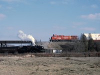 SSR 1057 Salutes the CP 2001 Christmas Train at an over and under meet just outside Tottenham Ont.  The CP train is poiniant as it departed from New York City less than 3 months after the destruction of the World Trade Center by terrorists. One of my favorite shoots