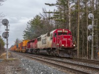 <b>Hockey Stick Nostalgia</b>.Having avoided Canadian Pacific's rebuild program, 1989 built SOO SD60 # 6033 still wears it's original 'Hockey Stick' paint as it hustles a lengthy train of stacks and racks through the west end of Guelph Junction. It is really nice to see a few of these veterans still earning revenue on CP, despite all the changes throughout the last couple of years.