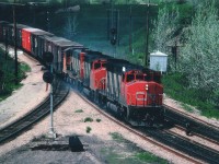 Some sun, some cloud and a little brake smoke brings out the highlights in this image. CN 9456 leads an eastbound freight thru Hamilton Jct on its way to Toronto.