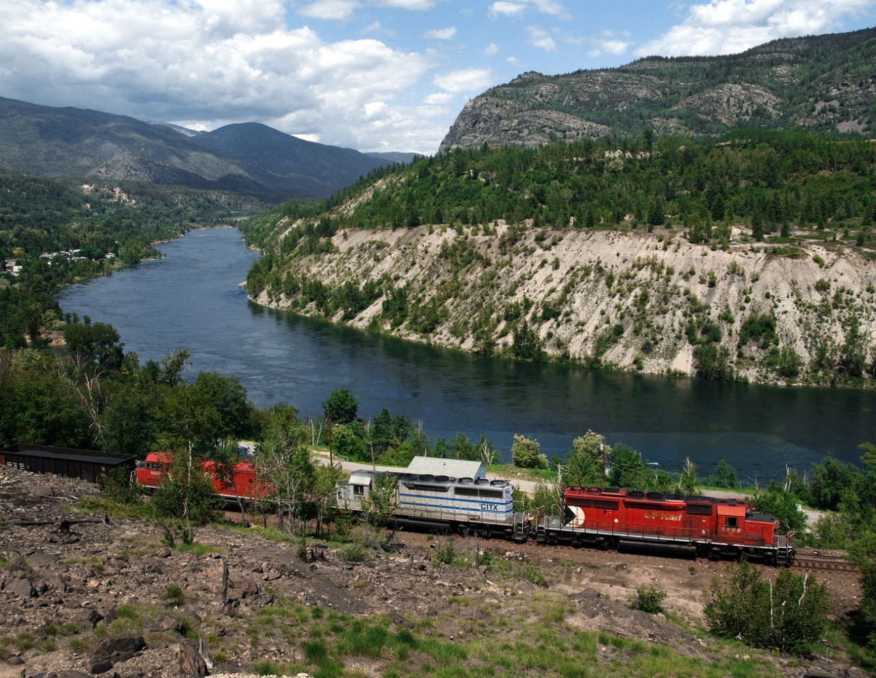 The westbound Trail freight approaches the Teck Cominco lead zinc Smelter on the Columbia River in the West Kootenay region of BC