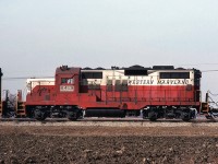 Western Maryland GP9 6413 is shown in-consist trailing a Chesapeake & Ohio train near Oldcastle ON on C&O's Subdivision 1. WM gave their early Geeps a taller chop-nose job than most, giving them a bit of an odd appearance that some will either love or hate. The unit in front is a GP30 or 35 in the Chessie System livery, the trailing unit 4813 a GP38 in B&O's blue dip. WM was absorbed into the B&O 4 years ago in 1983, and while some units were repainted into the Chessie System livery with WM reporting marks, 6413 still retains the WM's old "Circus colours" livery. 
<br><br>
At this point in 1987 operations were still as the Chesapeake & Ohio Railway, albeit under the Chessie System banner (since 1973). Subsidiary B&O would be folded into the C&O less than two months later on April 30th. Parent CSX Corporation would officially absorb the C&O Railroad into their new railroad division, CSX Transportation, a few months after on August 31st.
<br><br>
<i>Note: Geotagged location not exact.</i>