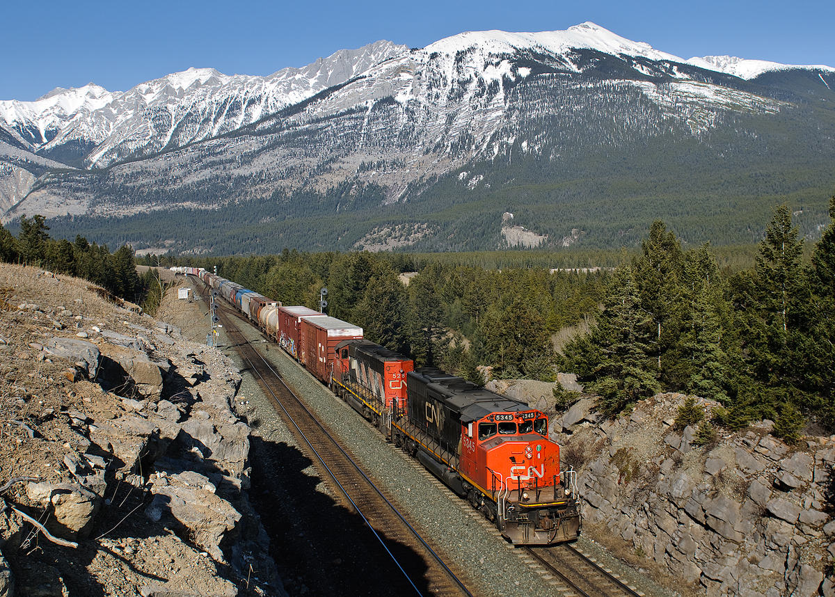 CN SD40-2Ws 5345 and 5281 struggle through English after having to stop their 70 car train on the grade at English account a stop signal.
