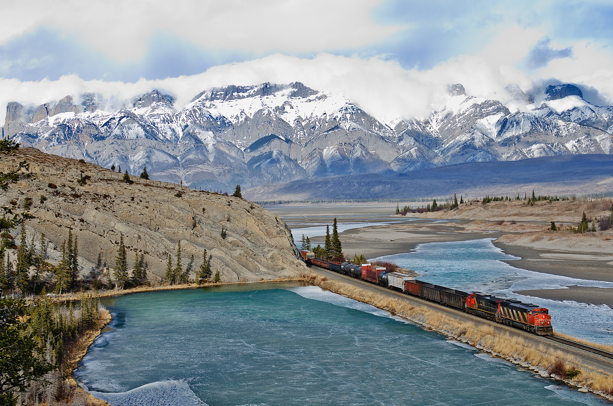 Extra manifest from Edmonton-Vancouver speeds west along the Edson Sub near Jasper behind CN SD60F 5513 and CN C44-9WL 2512.