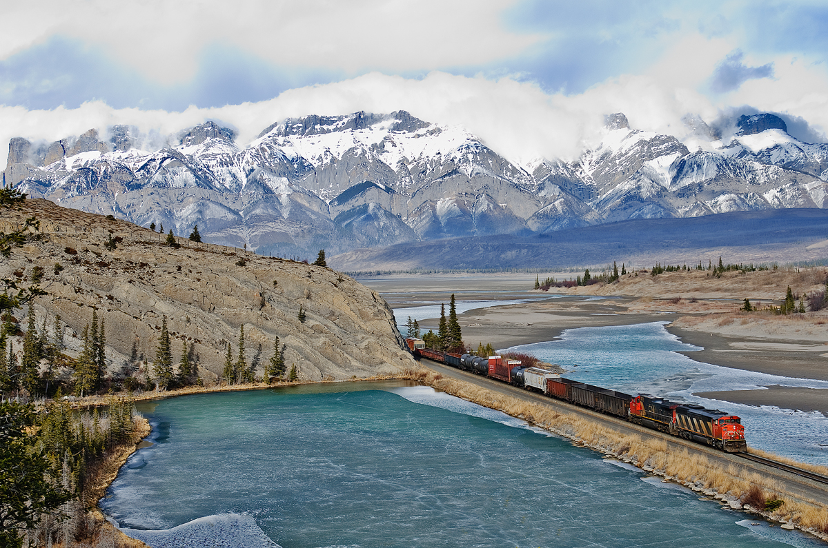 Extra manifest from Edmonton-Vancouver speeds west along the Edson Sub near Jasper behind CN SD60F 5513 and CN C44-9WL 2512.