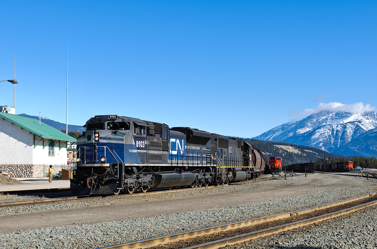 After changing crews, Edmonton-Prince Rupert grain train G847 departs Track 1 behind one of CN's 4 recently acquired ex EMD SD70ACe demo units. A pair of loaded coal trains wait their turn to depart in the background.
