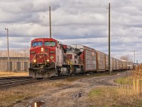 CP 9553 and NS Lackawana Heritage Unit 1074 lead CN 382 into Canada at Hobson (Sarnia). The tail end of the train is still in the St. Clair River Tunnel.