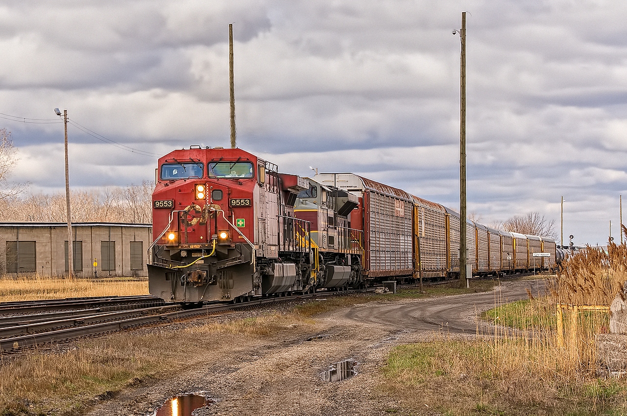 CP 9553 and NS Lackawana Heritage Unit 1074 lead CN 382 into Canada at Hobson (Sarnia). The tail end of the train is still in the St. Clair River Tunnel.
