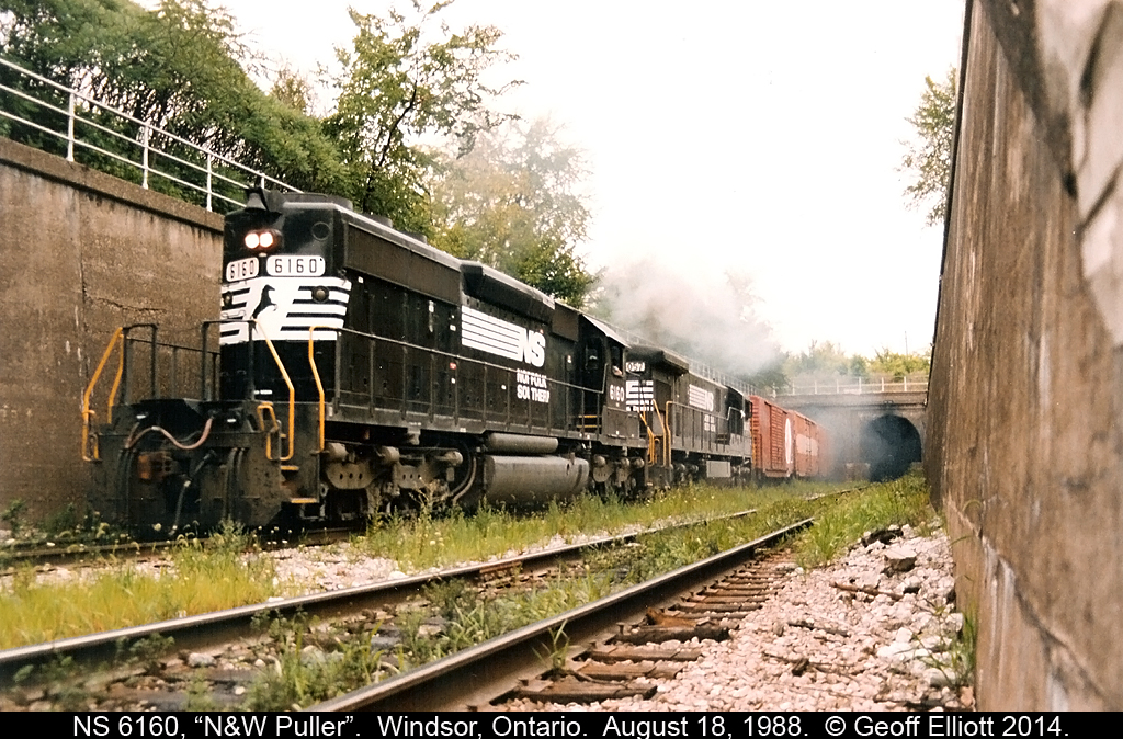 Norfolk Southern SD40-2 #6160 exits the Windsor/Detroit rail tunnel running long hood forward as the "N&W Puller" grinds upgrade making it's trip from Oakwood yard in Detroit to CP Windsor.  Don't you just love the Ann Arbor 50's boxcar that is first up on the train!!