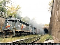 CSXT SD45 #8918 and a CSX GP40-2 blast out of the eastbound 'tube' with the "C&O Puller" bound for the CP yard in Windsor on an overcast September 1988 afternoon.  Would definitely not suggest going down here to shoot trains anymore.......