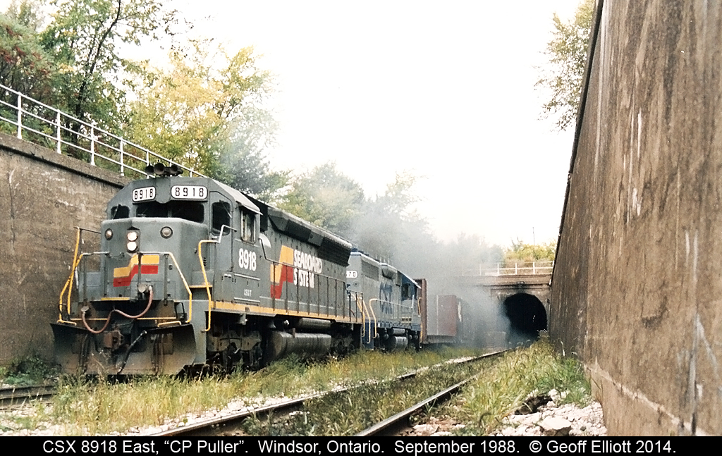 CSXT SD45 #8918 and a CSX GP40-2 blast out of the eastbound 'tube' with the "C&O Puller" bound for the CP yard in Windsor on an overcast September 1988 afternoon.  Would definitely not suggest going down here to shoot trains anymore.......
