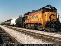 CSX B30-7 #5573 sits patiently in the north setoff track at Fargo, Ontario back in October of 1988.  5573 was setoff by CSX Train R320 as it moved across Southern Ontario on it's way to Buffalo from Detroit.  The cars behind 5573 will be lifted by the Local out of Chatham to move north, mostly to refineries in Sarnia.  When the local arrives it will bring cars for the westbound R321 to lift and place those in the south setoff.  R321 will also lift 5573 to use as additional power to make up for the extra tonnage they will lift in Fargo.  Today all that is left here are weeds....