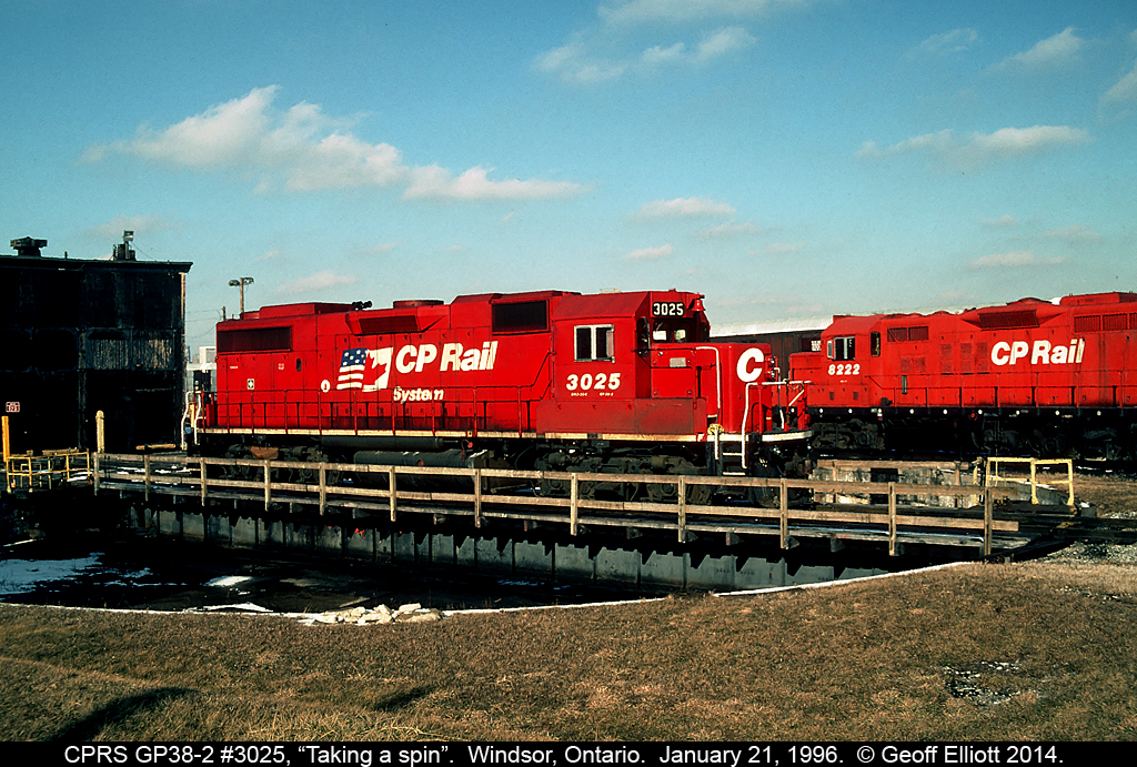 CP Rail Systems GP38-2 #3025 takes a spin on the turntable in Windsor, Ontario on a sunny January 1996 day.  Gone now are the roundhouse, and most likely the GP9, #8222, in the background all in the name of "progress".