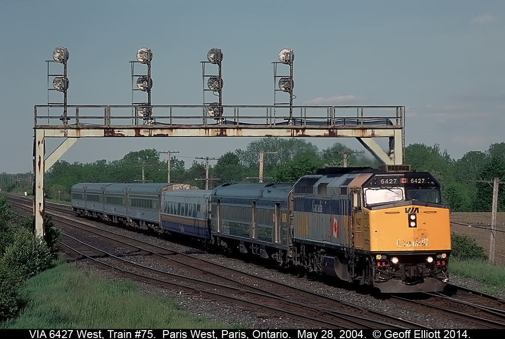VIA #6427 leads train #75, bound for Windsor, Ontario, with a mixed consist under the quadruple signal at Paris West.