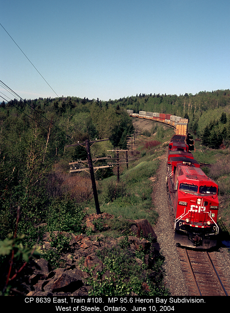 CP 8639 leans into the curve a MP 95.6 of CP's Heron Bay Subdivision.  On the far left you can see Lake Superior in the distance.  I followed this line many times while working in the north and would from time to time get 'lucky' and get a good shot.  Sadly by the time the work ended I was just good and familiar with the locations along the line, but in this case I think I made the most of it.....