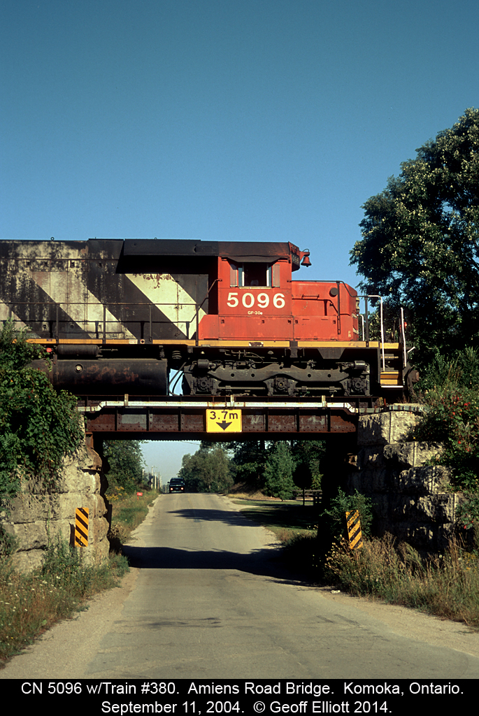 CN train #380 has CN SD40 #5096 in charge today as it passes over Aimens Road bridge just west of Komoka on the Chatham Subdivision back on September 11, 2004.