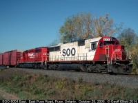SOO Line SD60 #6004 leads CPRS SD40-2 #5664 over the Puce River in Puce, Ontario back on October 29, 2005.