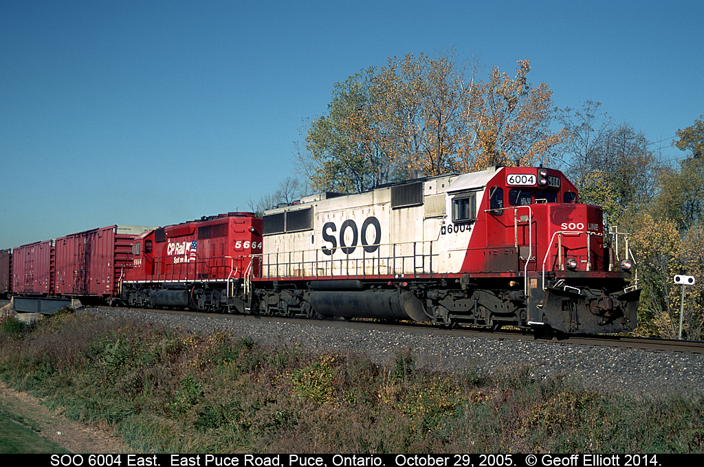 SOO Line SD60 #6004 leads CPRS SD40-2 #5664 over the Puce River in Puce, Ontario back on October 29, 2005.