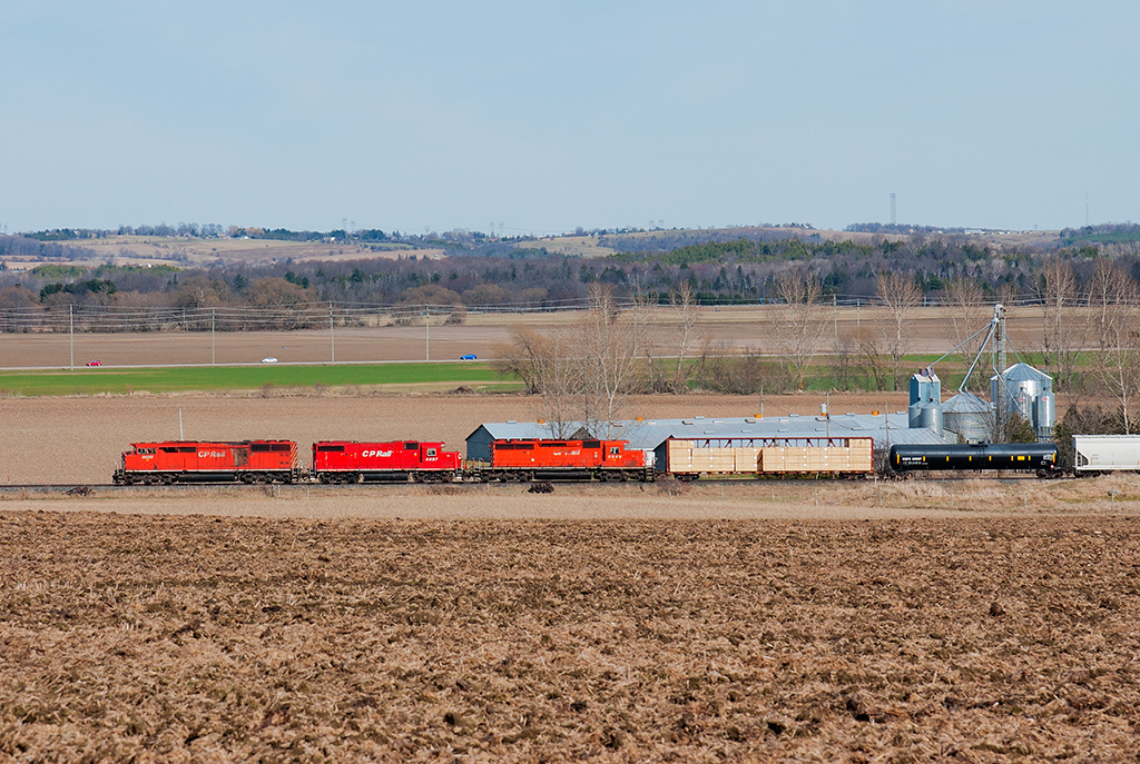 A red barn, a GP38-2 and a SD40-2 are today's flavours on CP 421.  Seen here racing through the country side north of Alliston, Ontario.