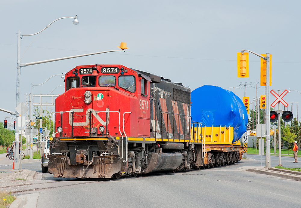 Although the light is harsh as can be due to the high sun, a rare daylight dimensional move from Babcox and Wilcox heads down the Toronto Harbour Spur.