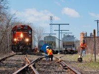 One of the last customers in Brantford, Ingenia Polymers receives service once a week and always on a Wednesday on the former TH&B Waterford Subdivision. Here the crew of CN 580 get's to work as the plant foreman takes down the blue flag.  
