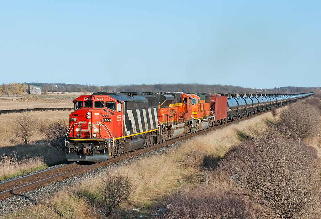 14,000 tons of crude head up grade at Mile 38 of the Halton Subdivision behind a stellar lashup.