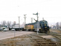 An eastbound C&O train with B&O GP40 3763 and a C&O 42xx GP40-2 is joining the joint track territory on the Conrail (ex-NYC CASO Sub) mainline at St. Thomas ON. Note the train order hoop post to the right of the lead unit, and the semaphore signals to the left.