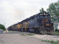 An eastbound Chesapeake and Ohio freight rolls through Leamington ON on Sub 1, with battered B&O GP40 4037 leading three units bearing newer Chessie System paint a year before CSX Transportation became the official company. A few years later, 4037 would be renumbered as CSXT 6612, but still retain its old B&O colours.
<br><br>
<i>Note, geotagged location not exact.</i>